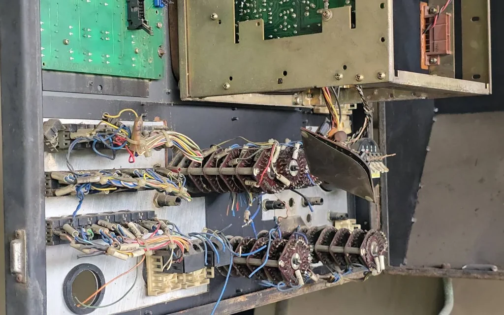 Disassembled electrical control panel with exposed circuit boards and wiring