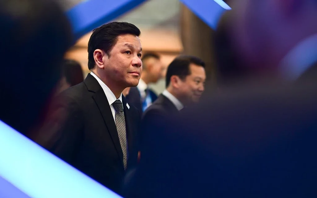 A man in a suit attending a formal event.