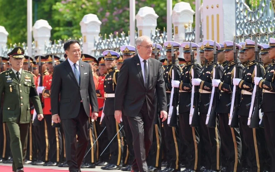 Anutin Charnvirakul welcomes the Swiss President at Government House in Bangkok.