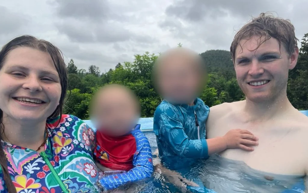 A family of four swimming in a pool in Chiang Mai.