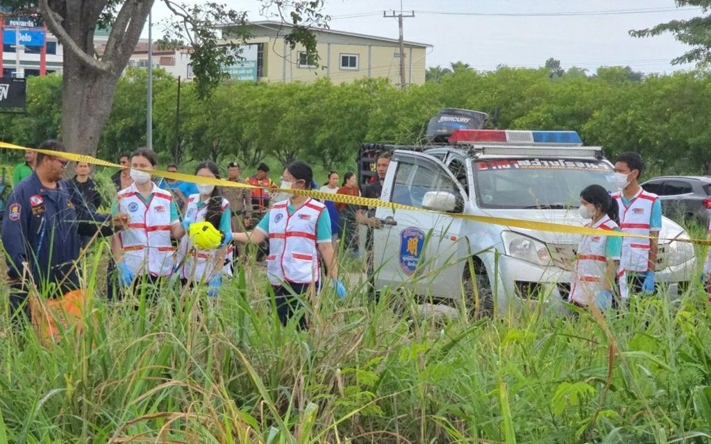Rescue workers at a scene with police tape in Chonburi.