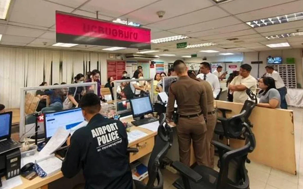 People filing a police report at an airport police station.