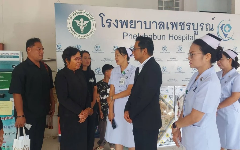 Hospital staff and family gather during an organ donation ceremony.