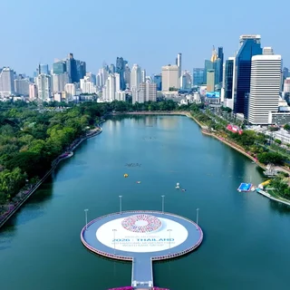 Aerial view of Benjakitti Park in Bangkok with event branding.