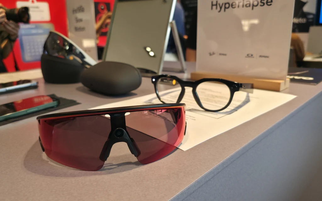 Smart glasses displayed on a table at a product launch event.