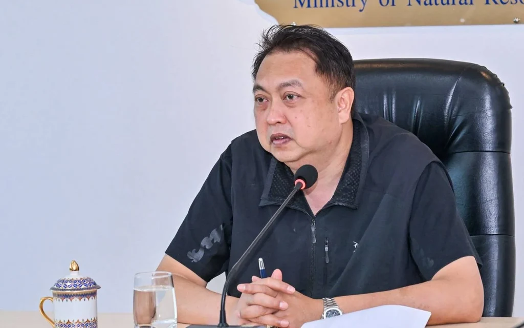 A man sitting at a table during a meeting.