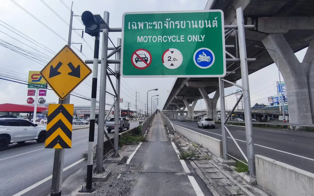 A motorcycle only bridge with traffic signs in Thailand.