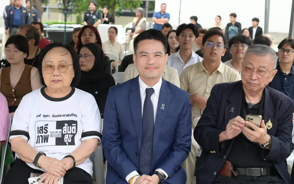 People attending a commemorative event for the 14 October uprising.