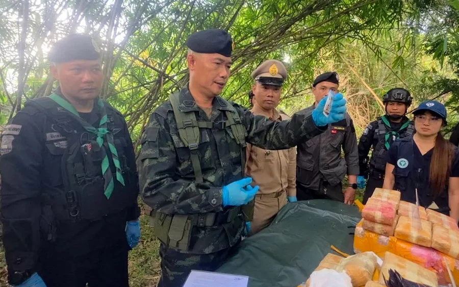 Rangers display seized packages during a forest operation in Chiang Rai.