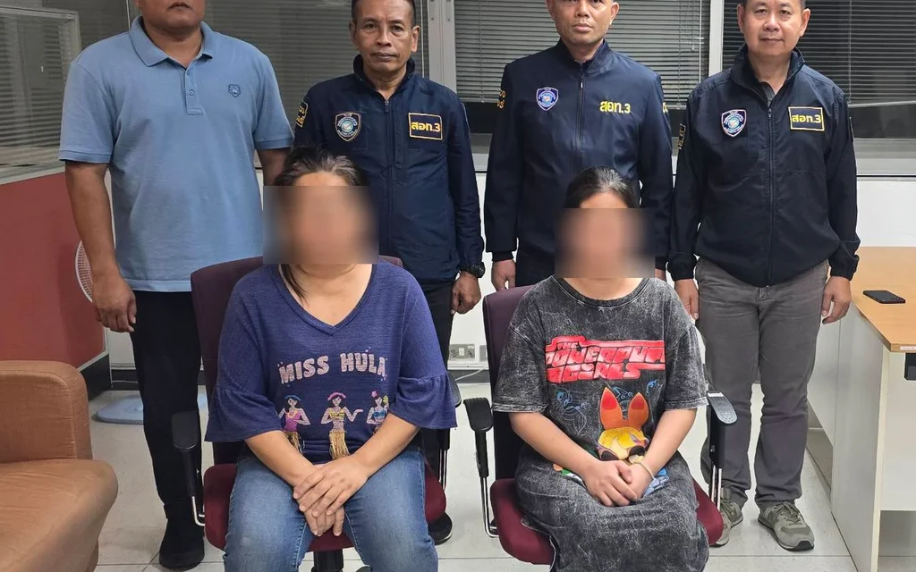Cyber police officers with two female suspects