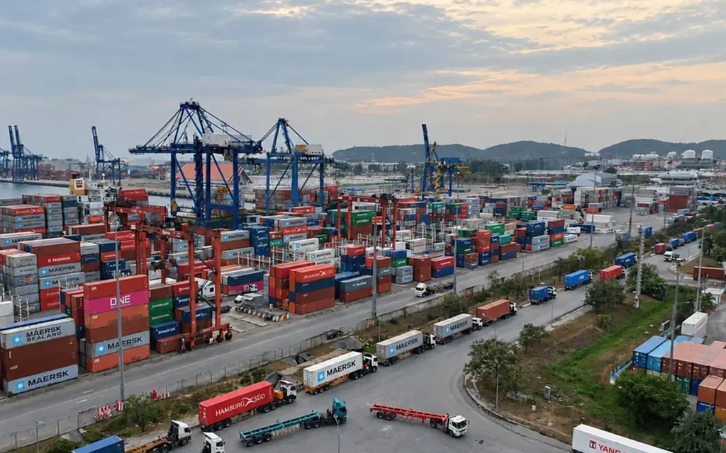 Container trucks and cranes at Laem Chabang Port.