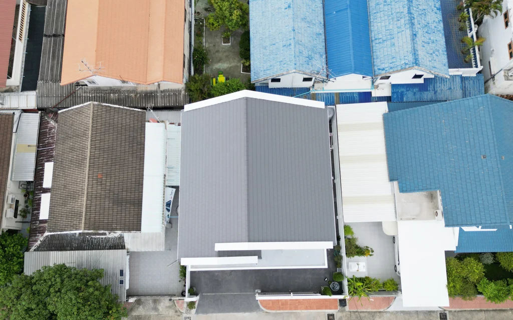 Aerial view of rooftops and buildings along a street