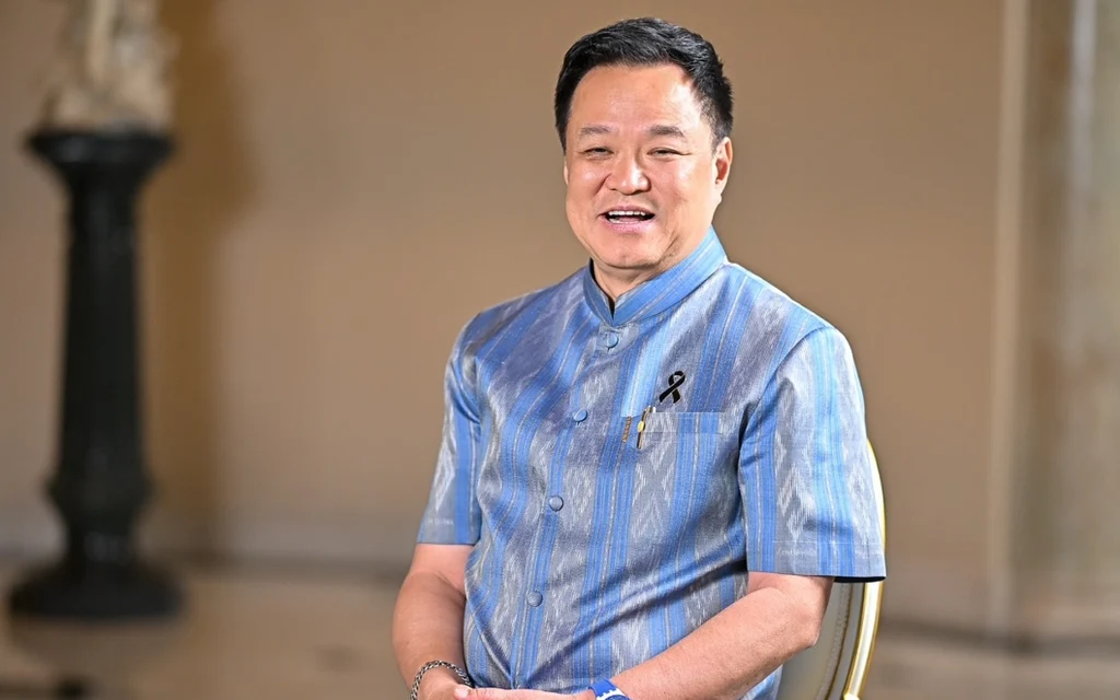 Anutin sits for an interview in a blue patterned shirt.