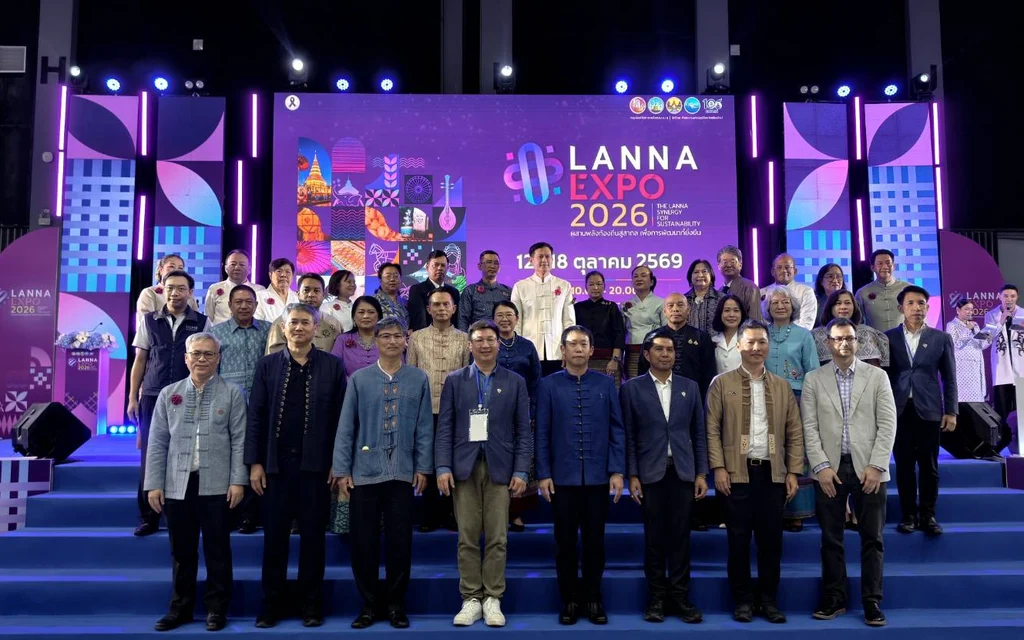 A group of people posing for a photo at Lanna Expo.