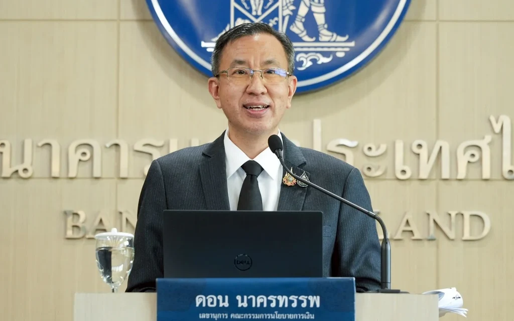 Bank of Thailand official speaks at a podium during a press briefing.