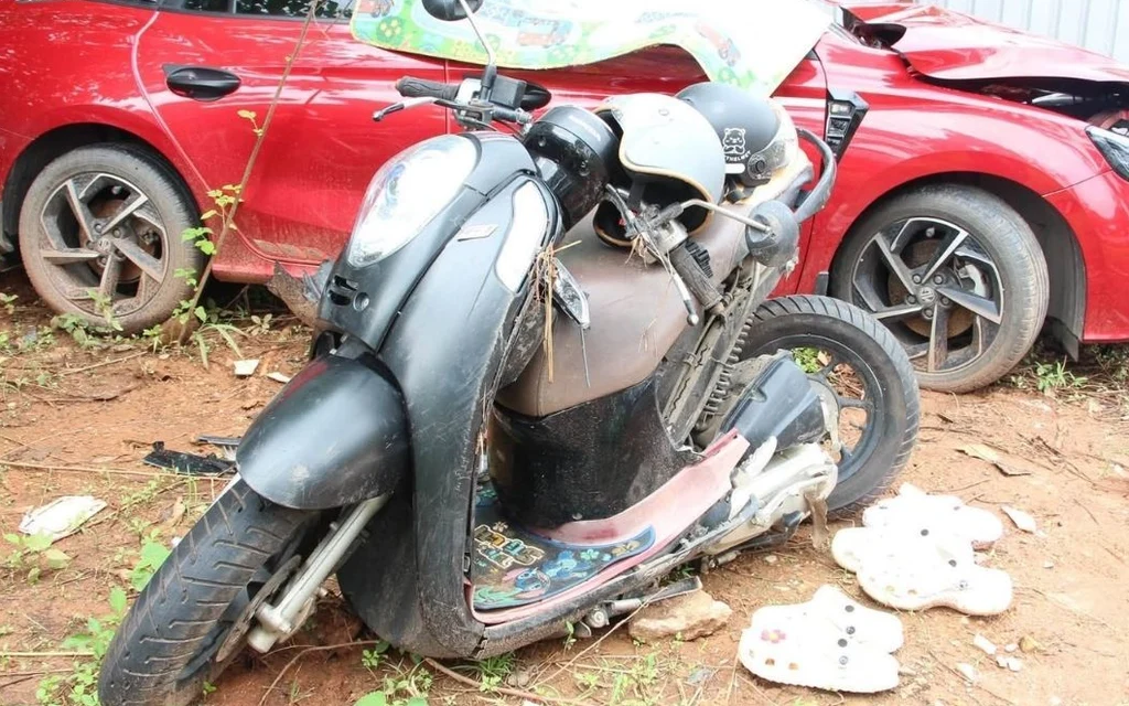 Damaged motorcycle and car after an accident