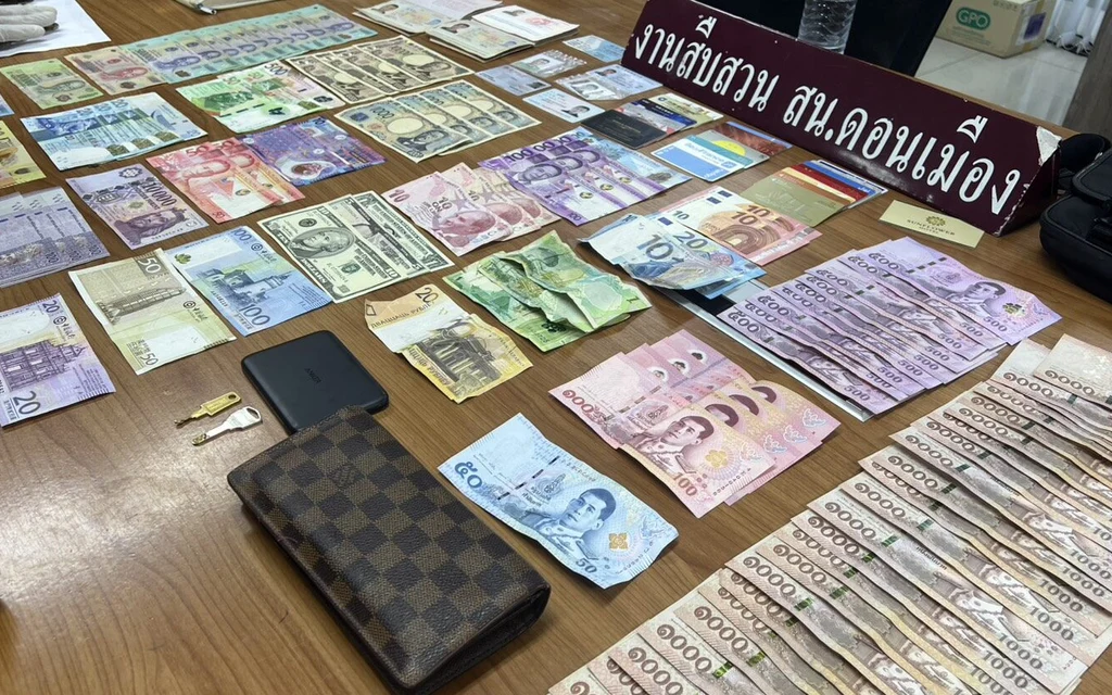 Evidence of stolen cash and items on a table.