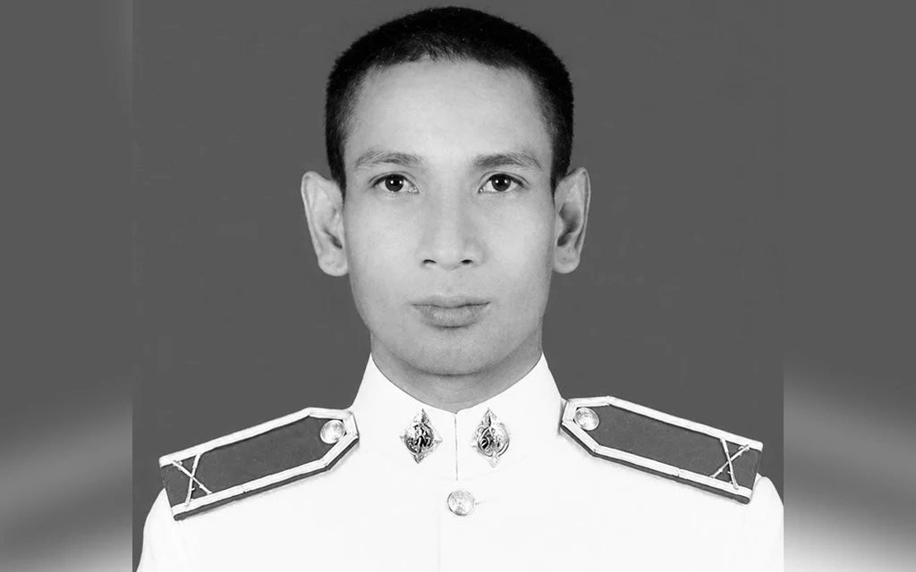 Black-and-white portrait of a man wearing a formal uniform.