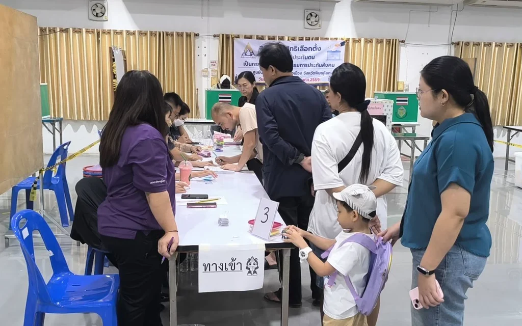People queuing to vote at a Social Security Board election station.