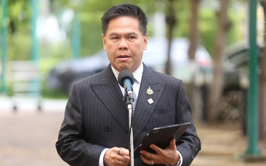 Thai Industry Minister speaking at a press conference.
