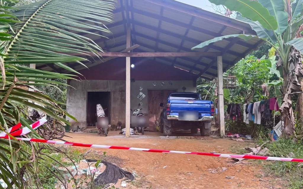 Police tape outside a rural house with a parked blue pickup truck