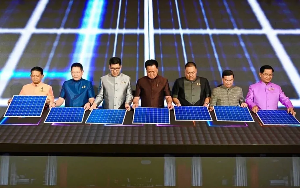 Officials present solar panels at a public event.