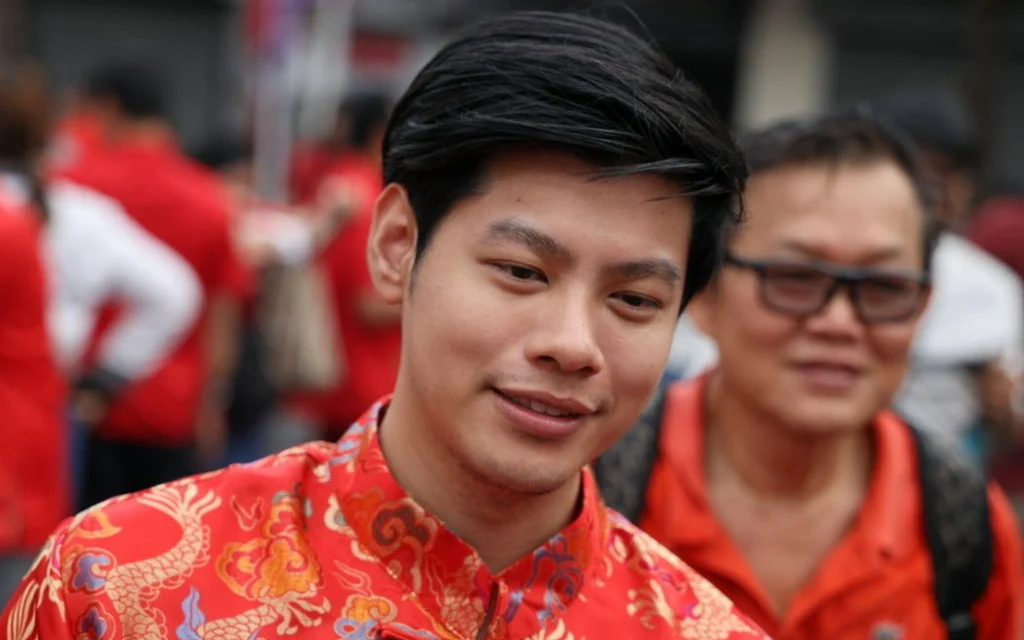A woman speaks at a podium with a microphone.